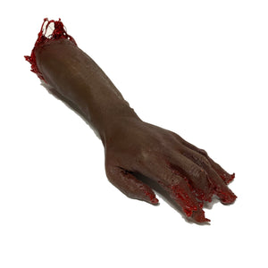 Severed Arm just below the elbow prop simulating a freshly severed bloody arm for use in visual effects work in film, television and stage.