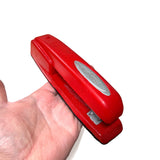 Milton's Red Swingline Office Stapler safe prop made of foam rubber for use in stunt work for television, movies, or live theater.